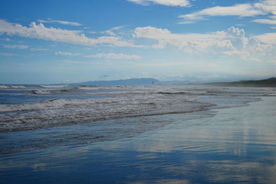 Scenic view of beach against sky