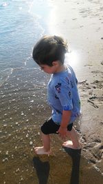 Boy standing on beach