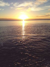 Scenic view of sea at sunset