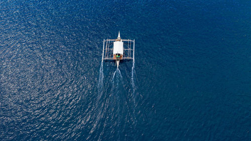 High angle view of sailboat sailing in sea