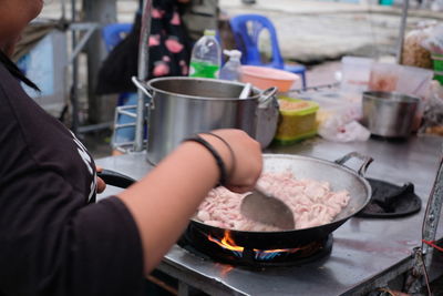 Cropped image of woman preparing food