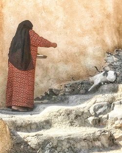 Woman standing with umbrella