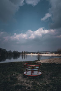 Scenic view of boat in lake against sky