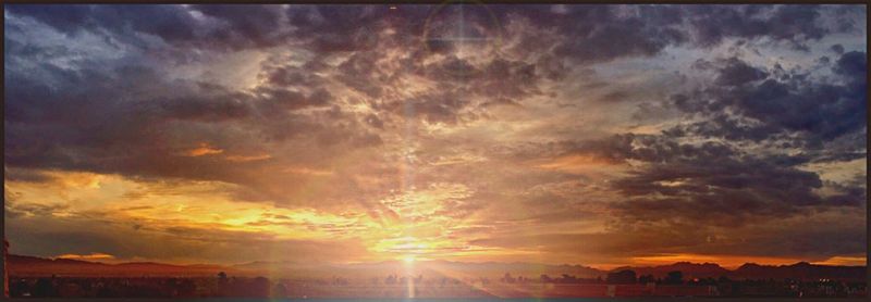 Scenic view of cloudy sky at sunset