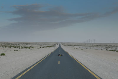 Empty road against sky