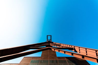 Low angle view of building against blue sky