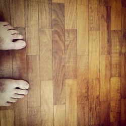 Low section of people on hardwood floor