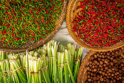 Red chili peppers in container at market