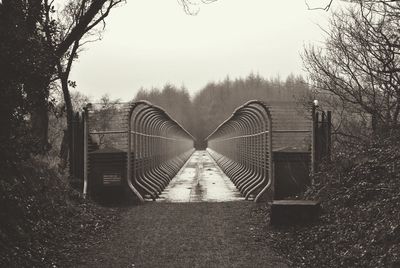 Footbridge against sky