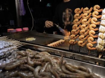 Meat on barbecue grill in store