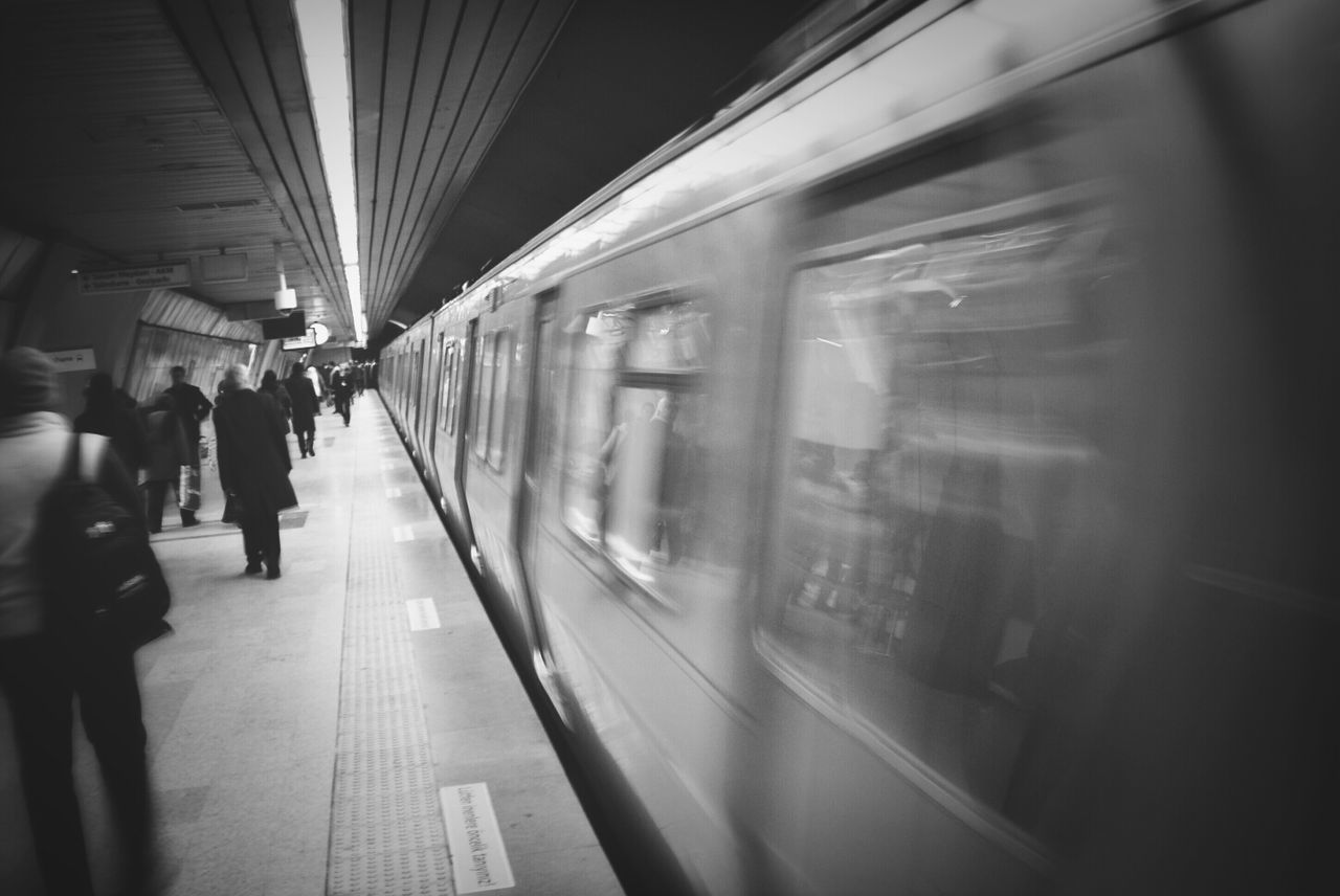 indoors, transportation, public transportation, railroad station, rail transportation, illuminated, railroad station platform, travel, subway station, subway, the way forward, mode of transport, architecture, train - vehicle, built structure, passenger, journey, ceiling, incidental people