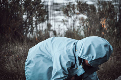 Rear view of man standing on field