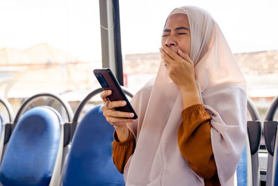 Young woman using mobile phone