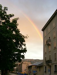 Rainbow over buildings
