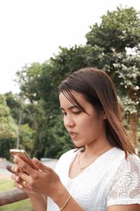 Young woman using mobile phone