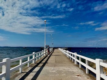 Pier over sea against sky