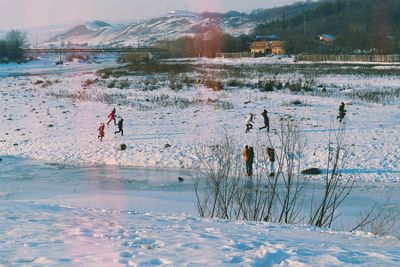 Scenic view of lake against sky during winter