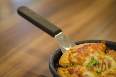 Close-up of pizza in bowl on table