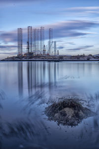 Reflection of building in city during winter