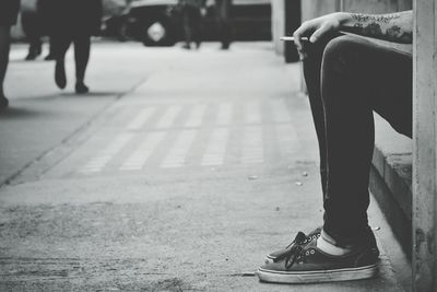 Low section of people walking on road