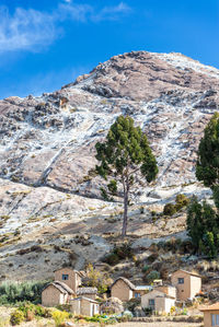 View of mountain range against blue sky