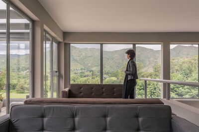 Man sitting on sofa at home