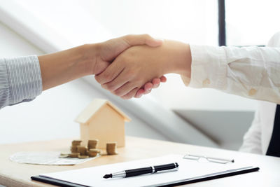 Close-up of hands holding table