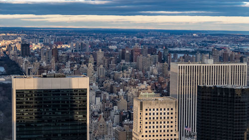 High angle view of modern buildings in city against sky