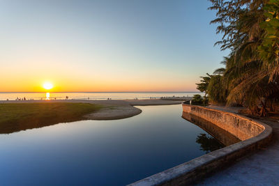 Scenic view of sea against clear sky during sunset