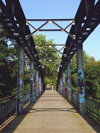 Bridge leading to bridge against sky