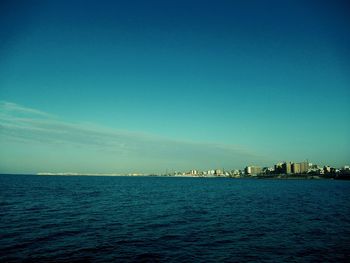Scenic view of sea against blue sky