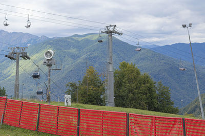 Lifts of the mountain cable car on the background of mountains