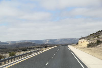 Surface level of empty road along landscape