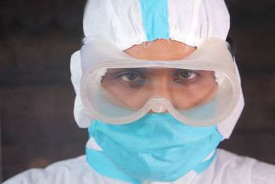 Close-up portrait of man wearing mask