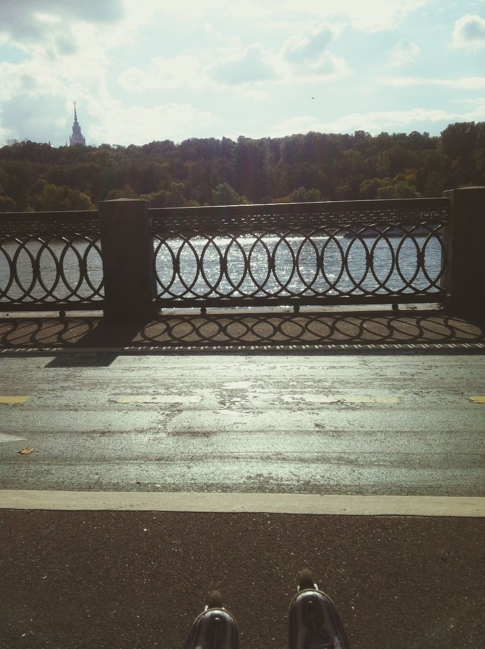 water, sky, railing, bridge - man made structure, metal, river, cloud - sky, lake, connection, outdoors, day, tranquility, nature, metallic, pier, transportation, sunlight, built structure, tree, fence