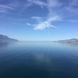 Scenic view of sea against blue sky