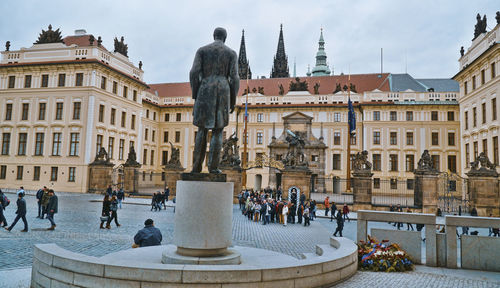 Group of people in front of buildings