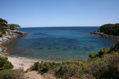 Scenic view of sea against clear blue sky