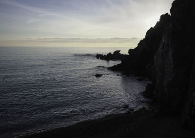 Scenic view of sea against sky at sunset