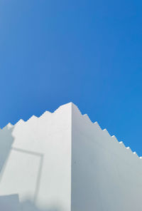 Clean white building with blue sky