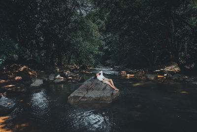 River flowing through rocks in forest