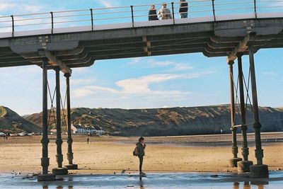 Man on beach against sky