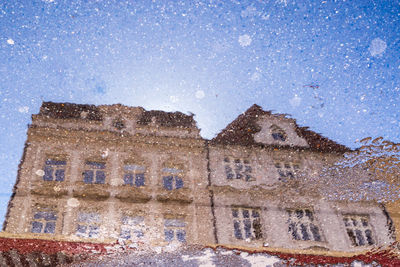 Low angle view of old building against sky
