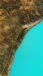 High angle view of landscape against clear blue sky