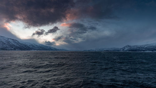 Scenic view of sea against sky during winter