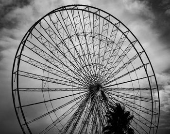 Low angle view of ferris wheel against sky