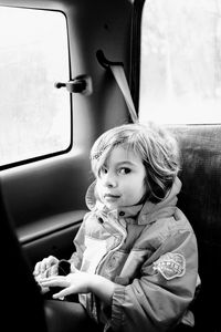 Portrait of girl traveling in car