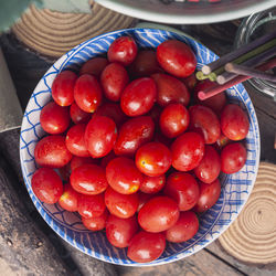 High angle view of cherries in bowl on table