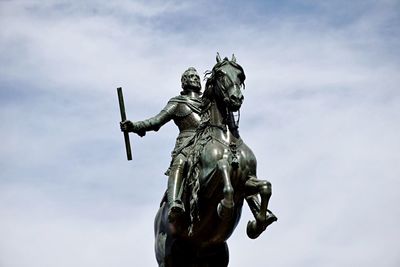 Low angle view of statue against sky