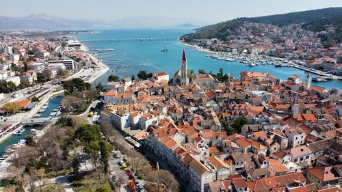 High angle view of townscape by sea